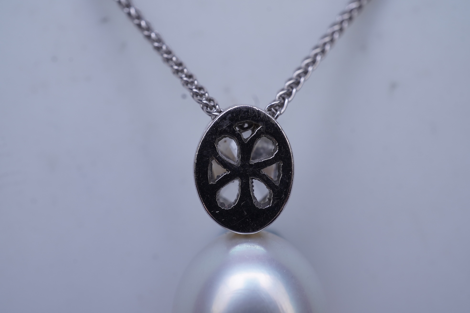 A cultured pearl and diamond pendant